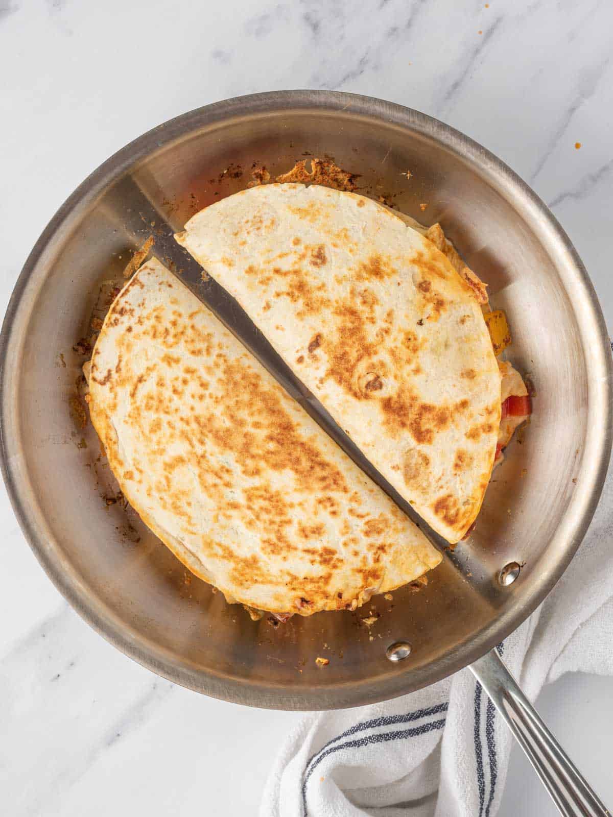 Homemade quesadilla recipe in a pan.