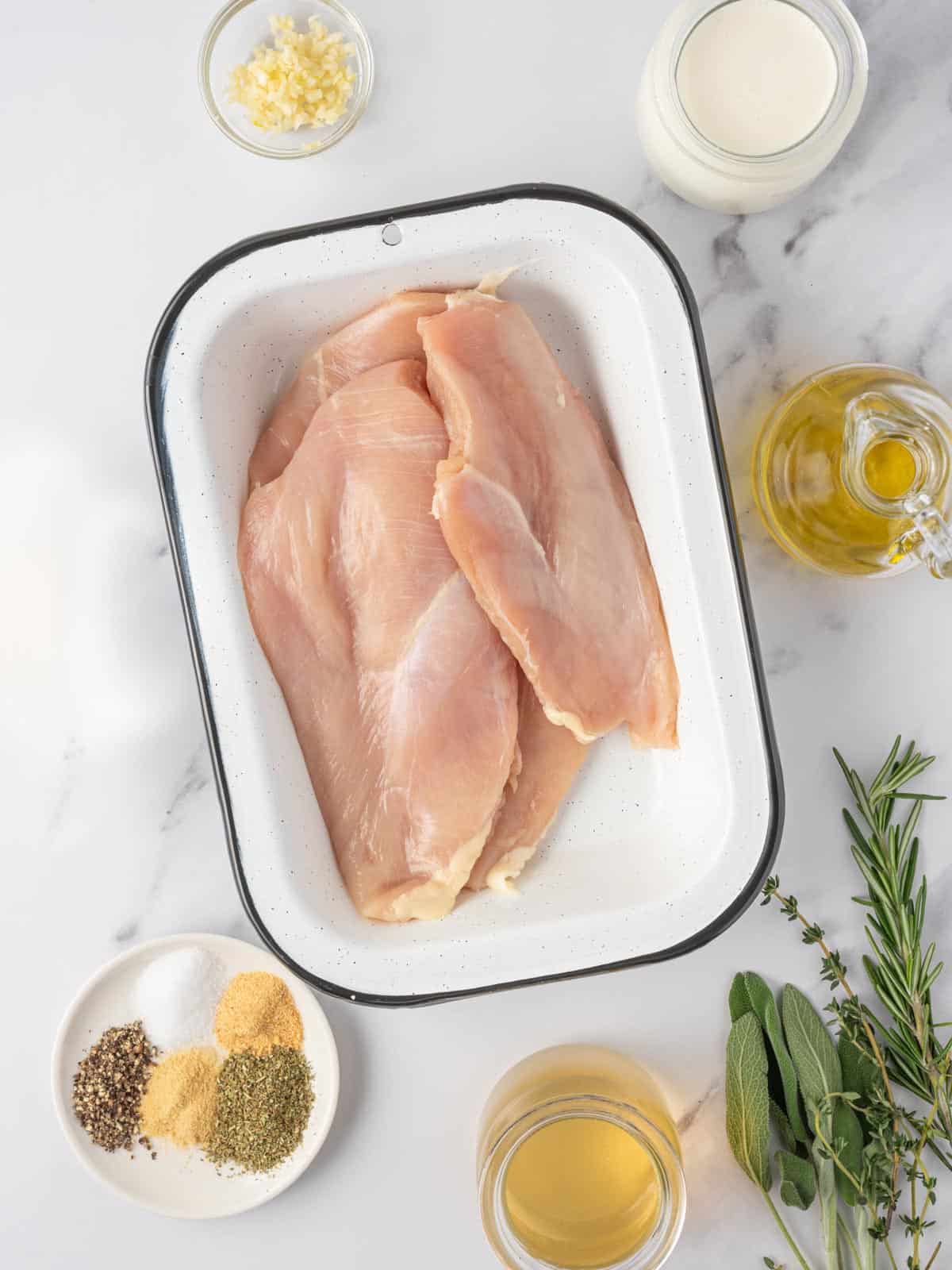Ingredients needed for creamy herbed chicken.
