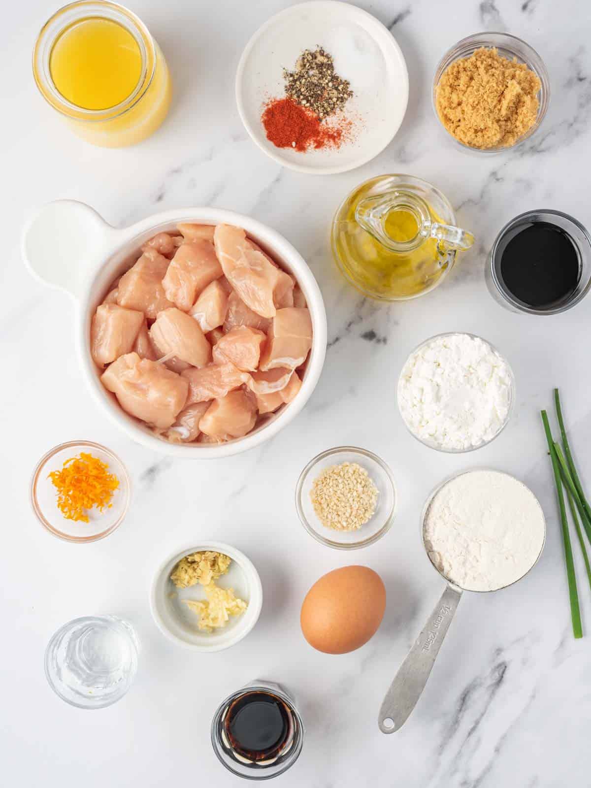 Ingredients needed for crispy air fryer orange chicken.