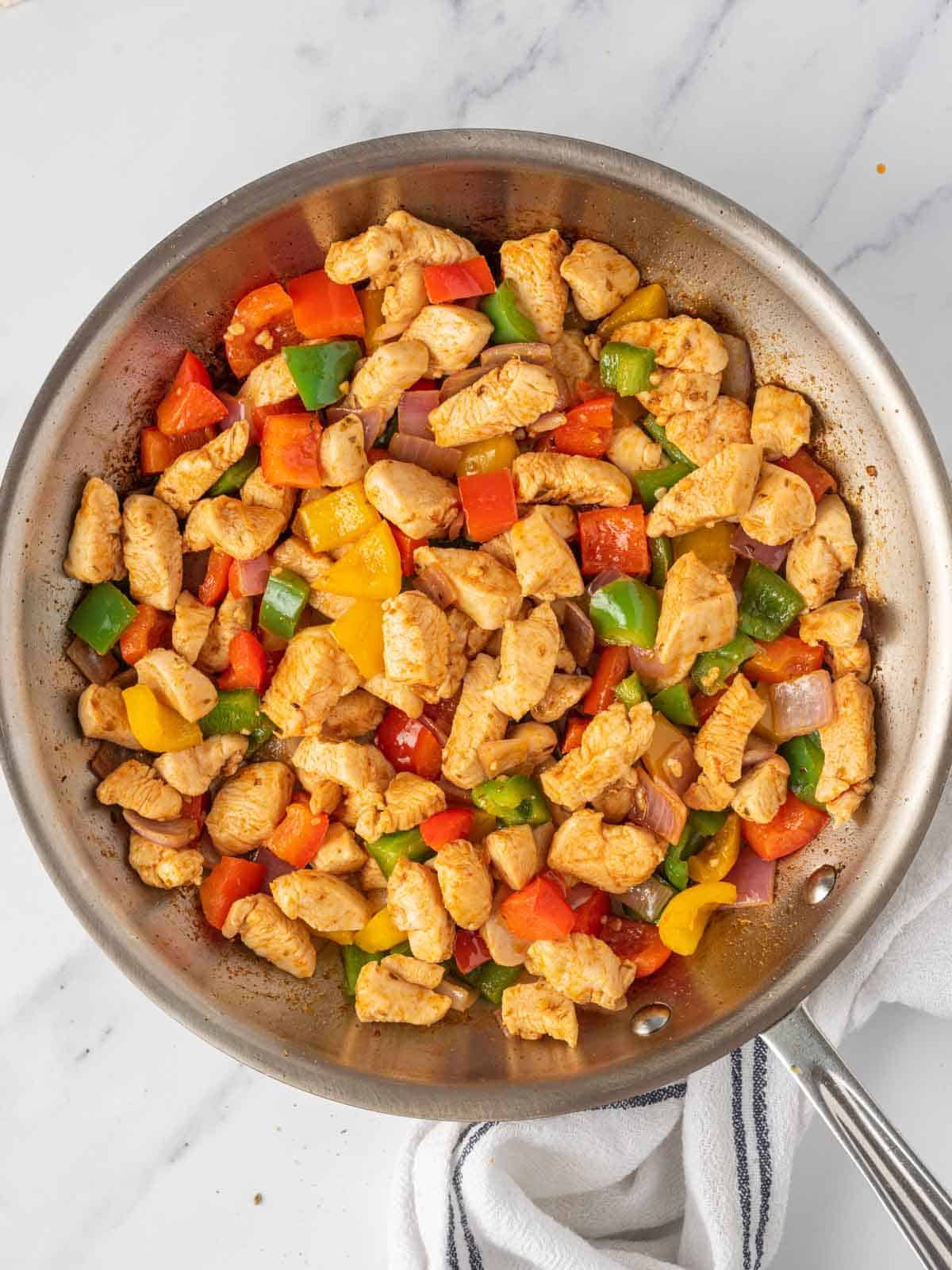 Making the easy chicken quesadillas filling.