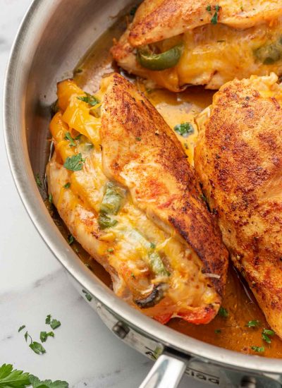 Mexican stuffed chicken in a pan.