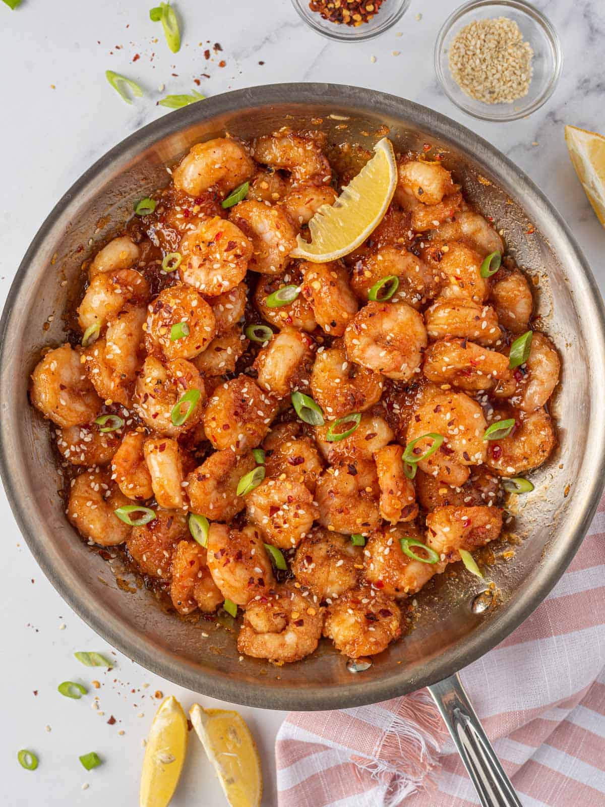 Spicy fried shrimp with firecracker sauce in a skillet.