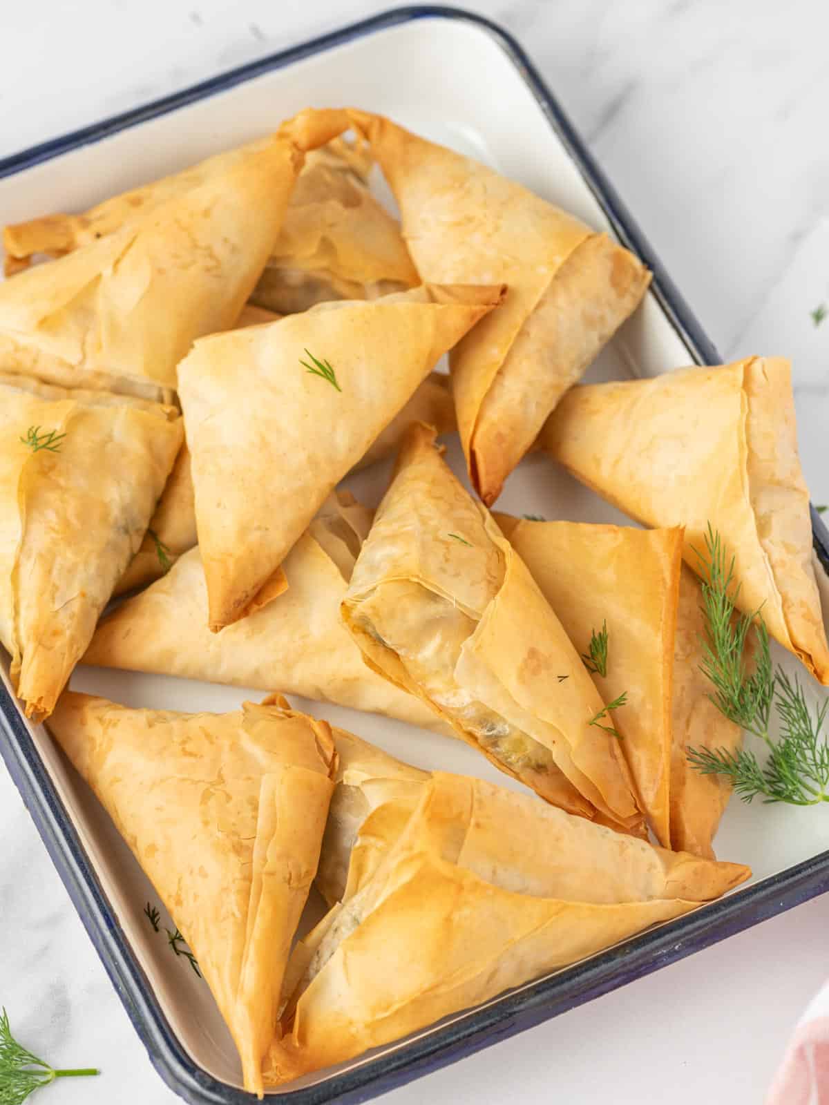 Easy spanakopita recipe on a serving tray.