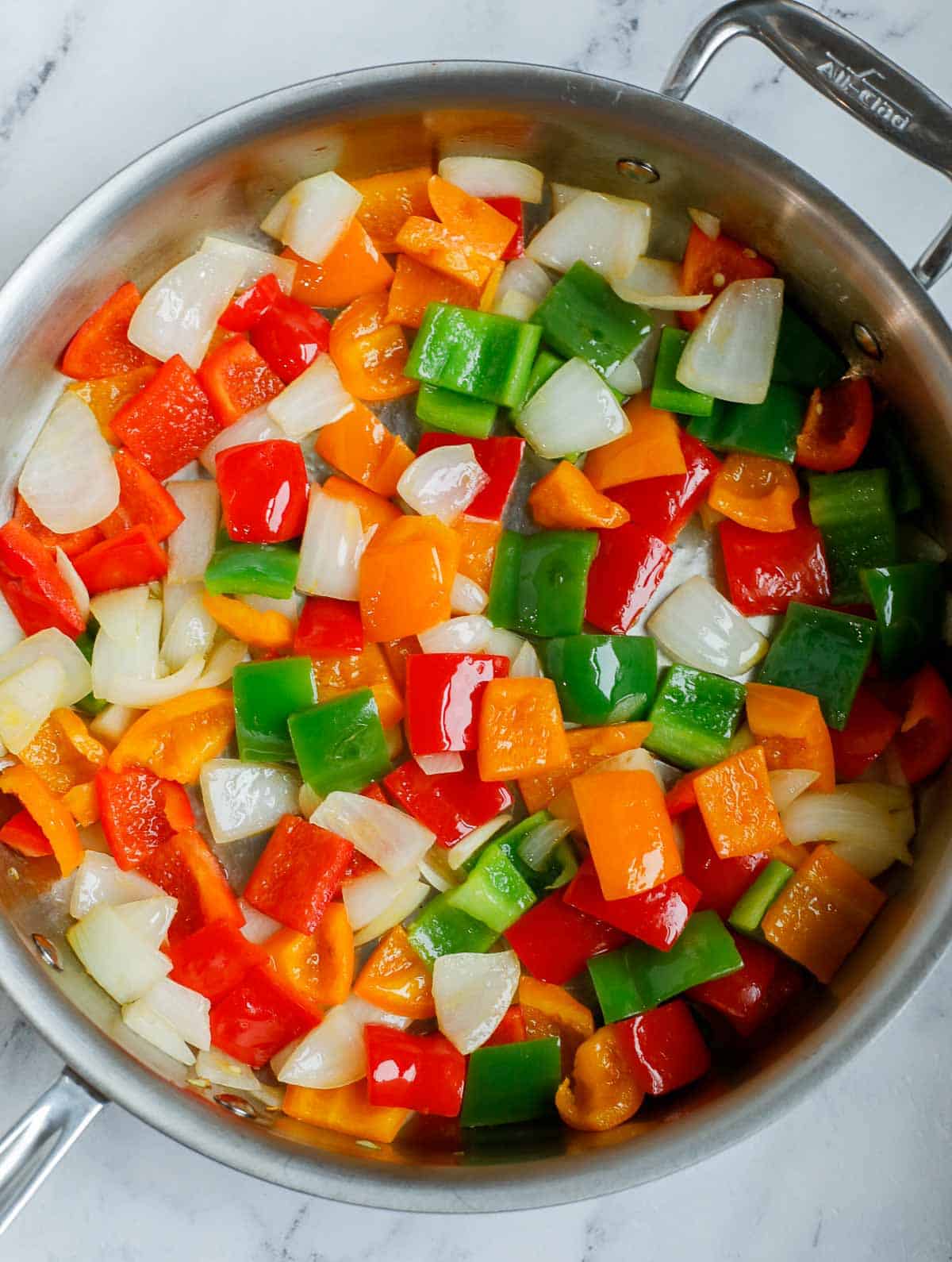 Stir fry veggies for sweet and sour chicken.