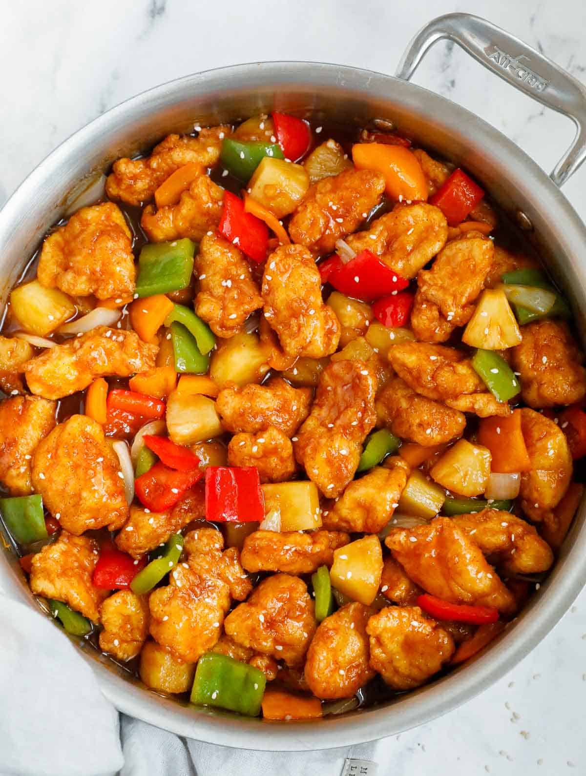 Chicken tossed with easy sweet and sour sauce in a skillet.