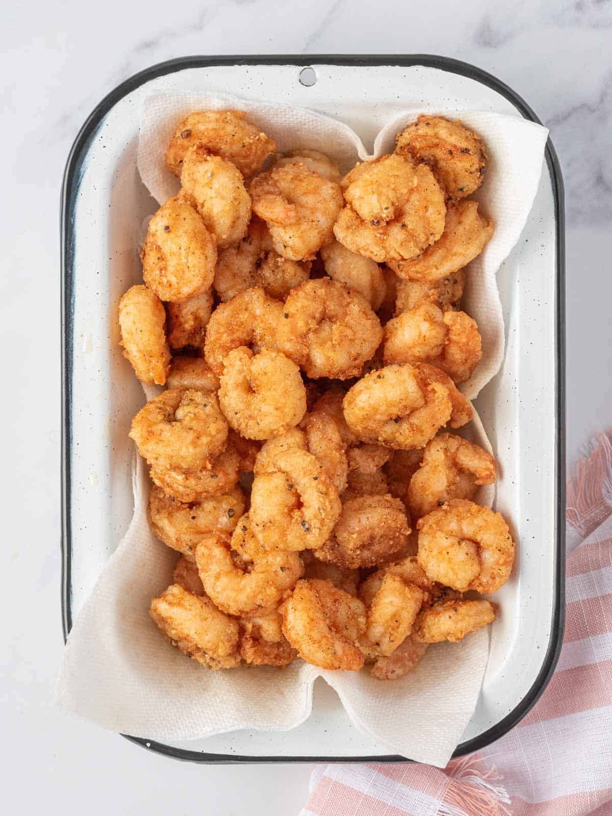 A platter full of fried shrimps.