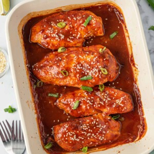 A tray of sweet and spicy honey sriracha chicken.