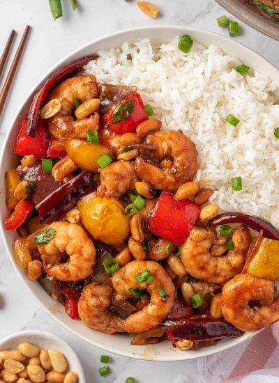 Spicy shrimp stir fry in a bowl with rice.