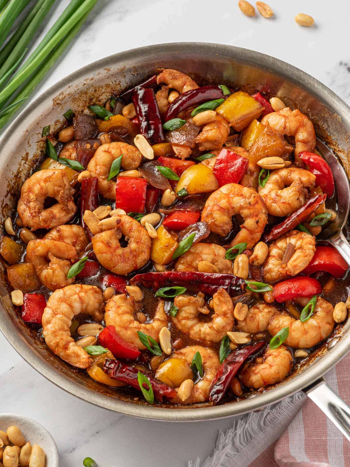 All of the ingredients for Chinese shrimp in a skillet.