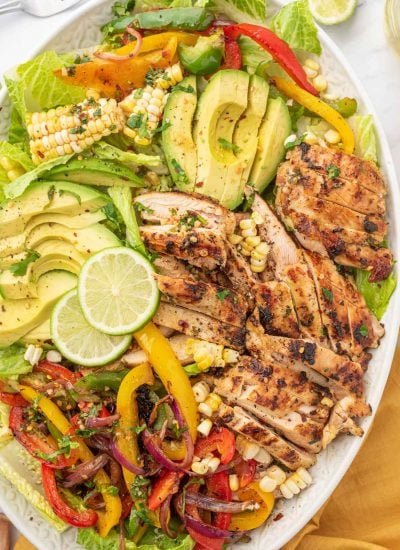 Fiesta lime chicken salad with lime garnish on a platter.