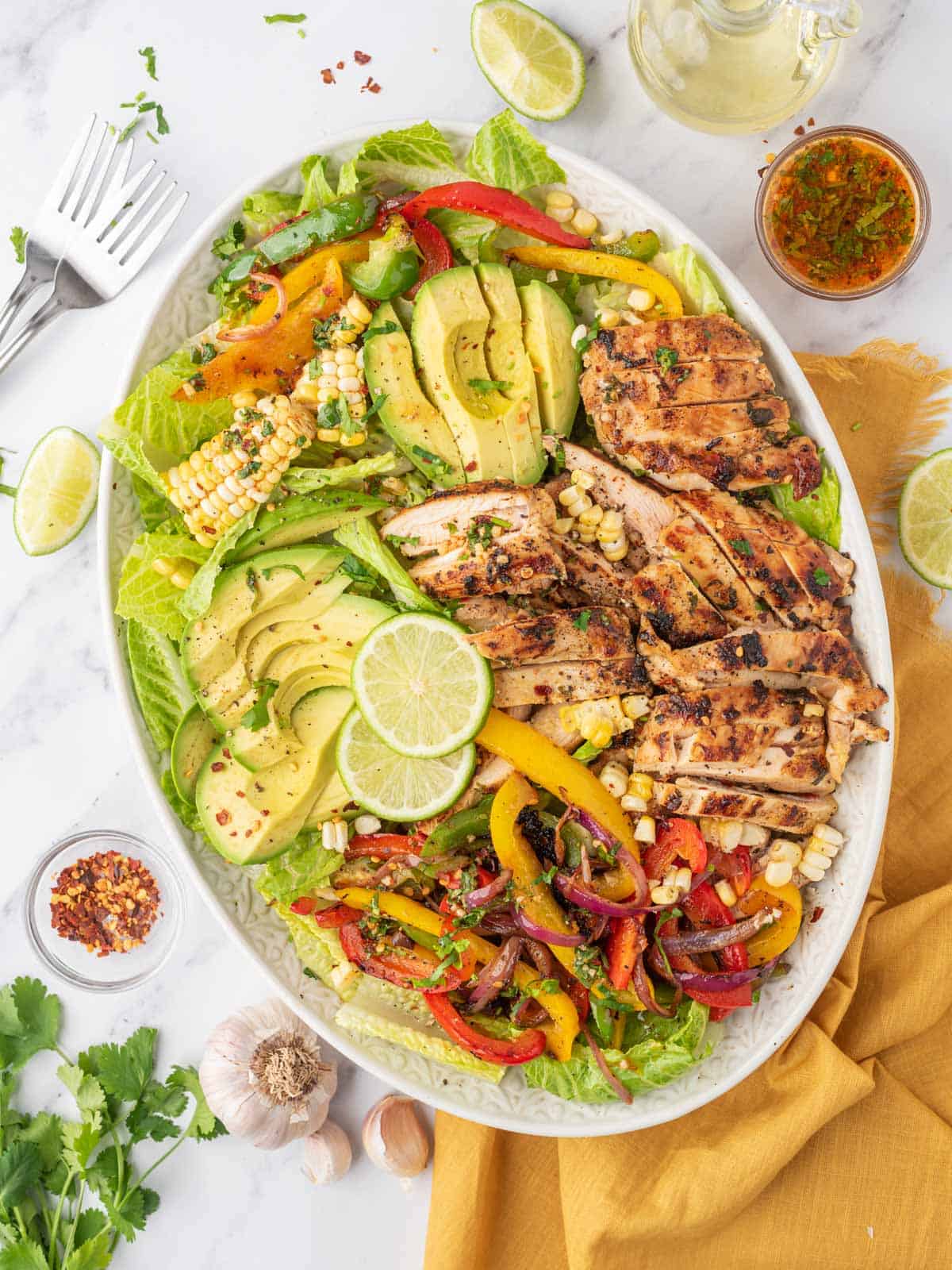 Fiesta chicken salad platter with forks on the side.
