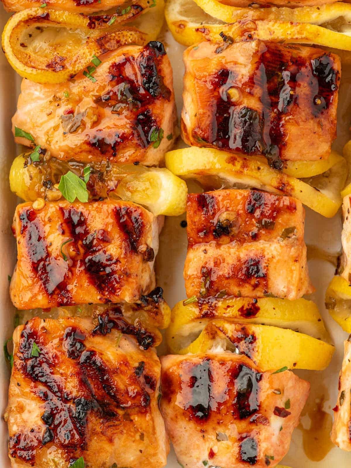 Closeup of salmon skewers with honey garlic butter.