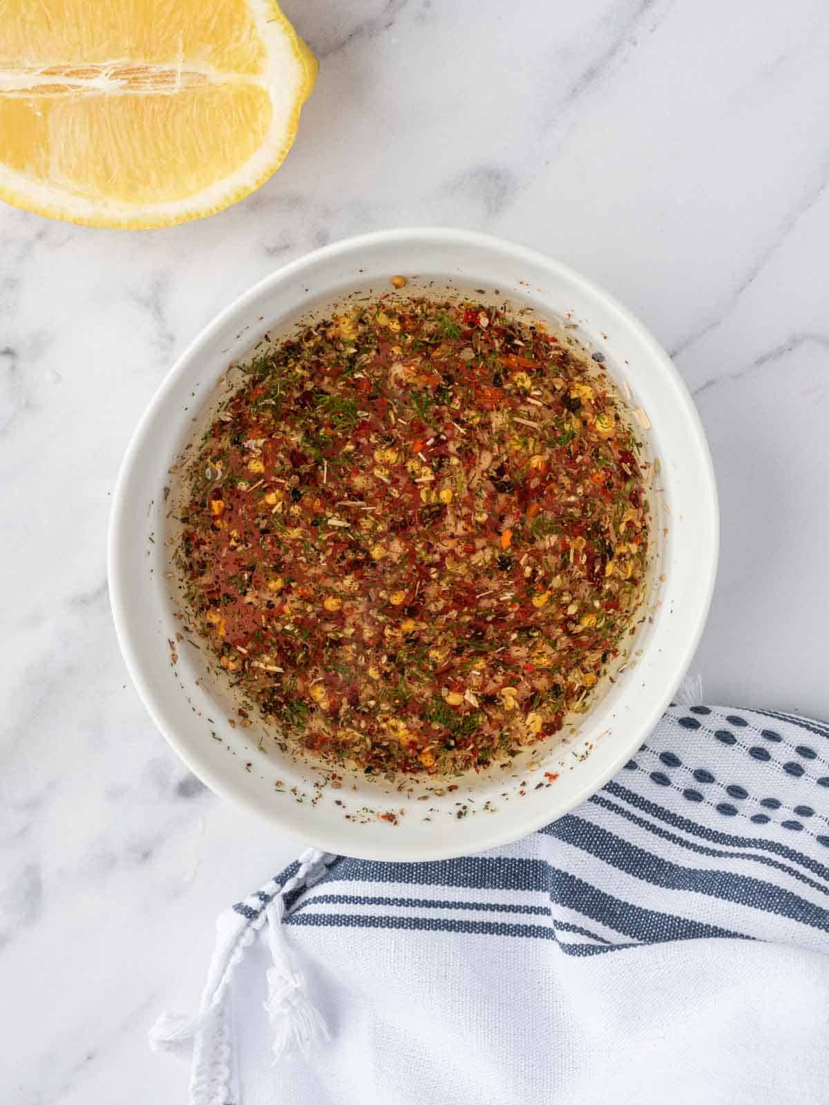 Mediterranean salmon salad marinade in a bowl.