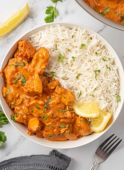 A bowl of indian tikka masala with chicken.