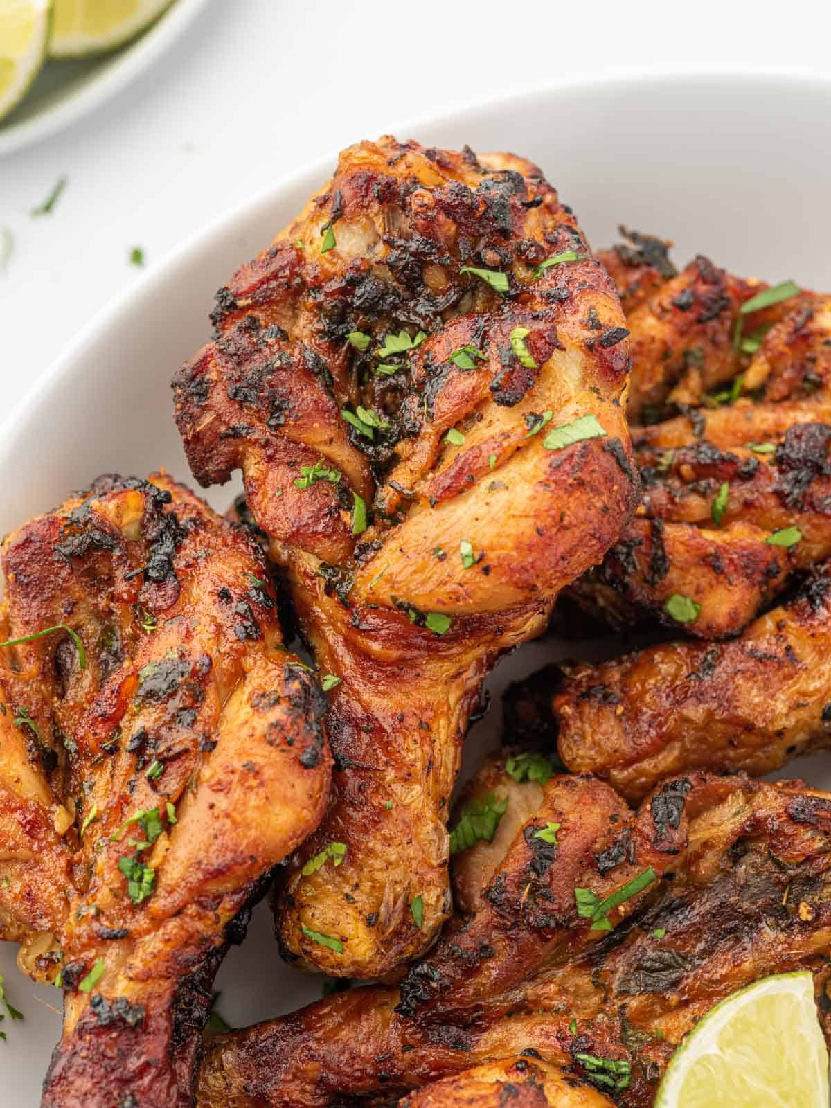 Closeup of airfryer chicken drumsticks.