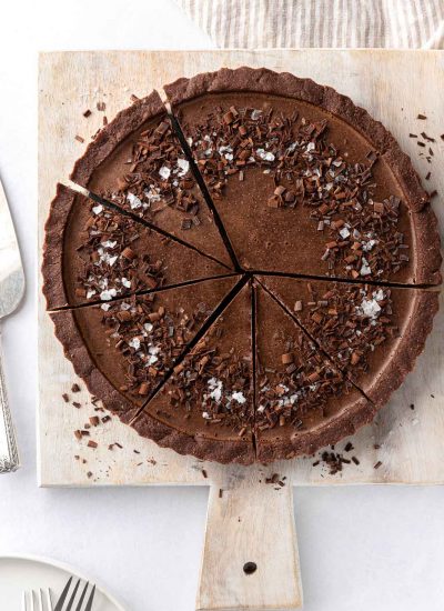 Sliced of vegan chocolate pie on a board.