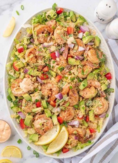 Shrimp salad with lettuce and avocado on a platter.