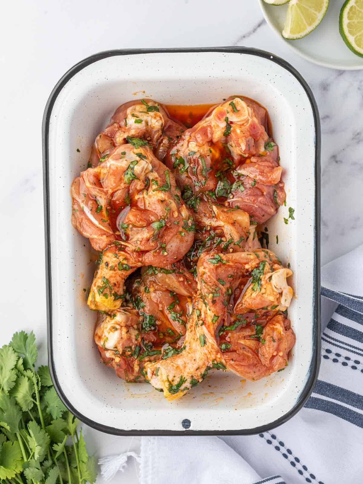 Chicken marinating in cilantro lime sauce before air frying.