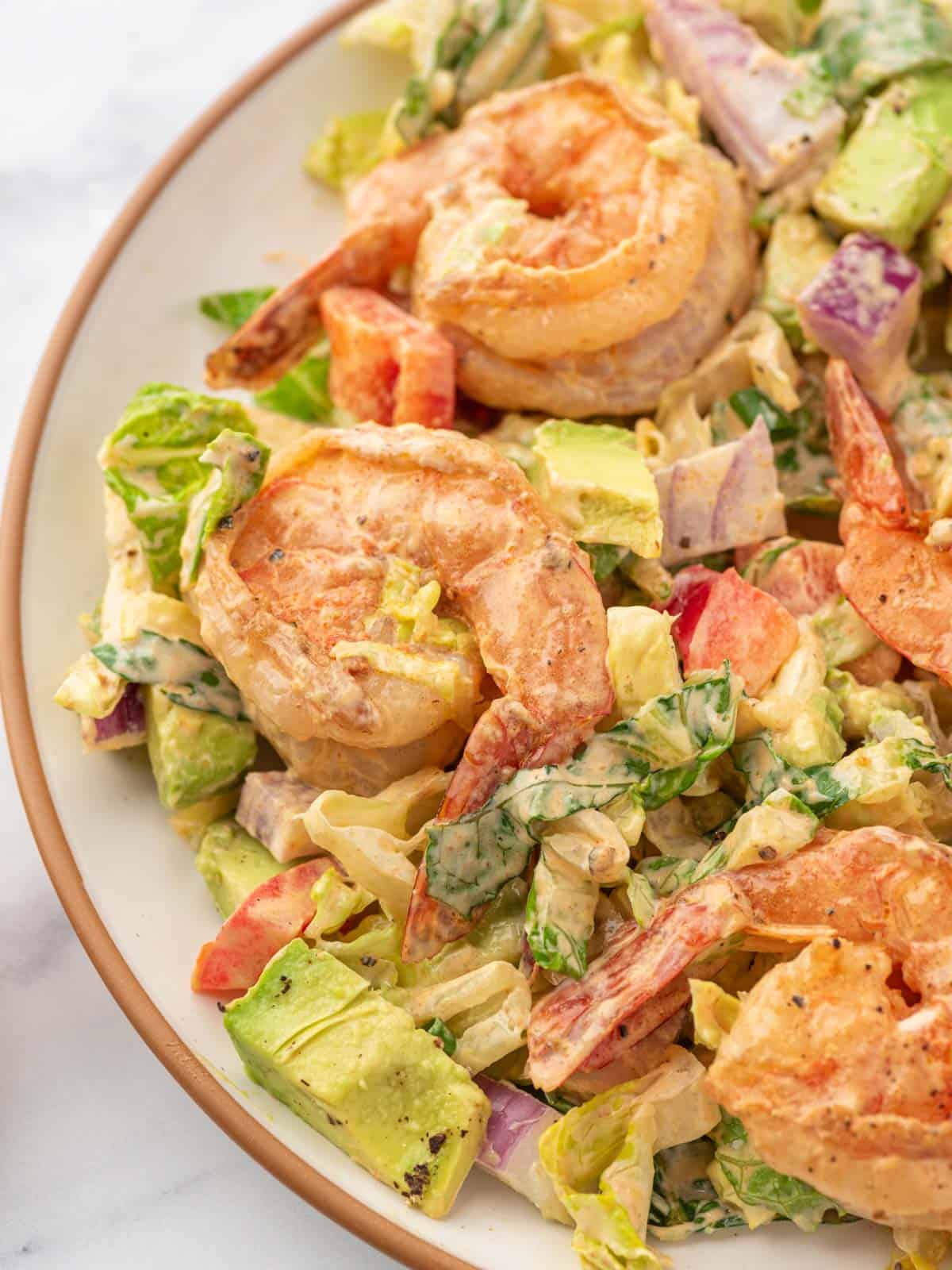 Shrimp avocado salad on a plate.