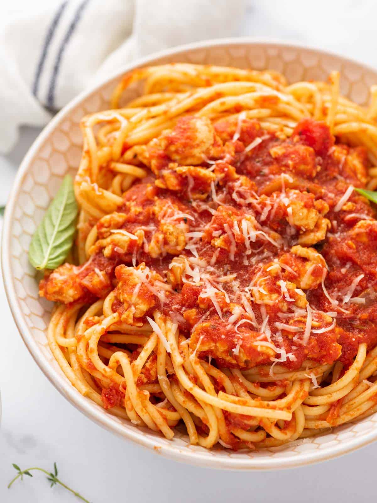 A bowl of chicken spaghetti bolognese.