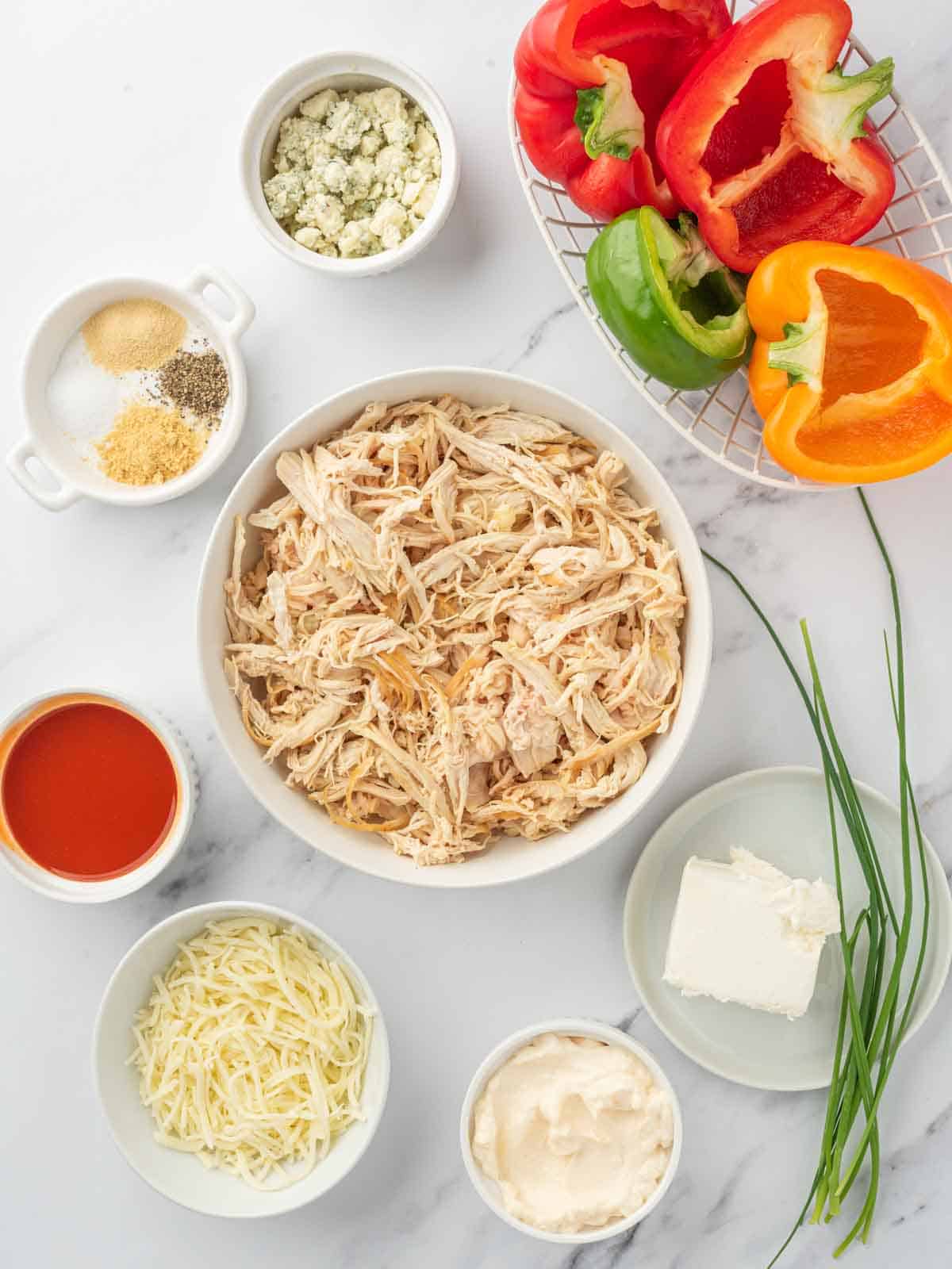 Ingredients needed for buffalo chicken stuffed peppers.