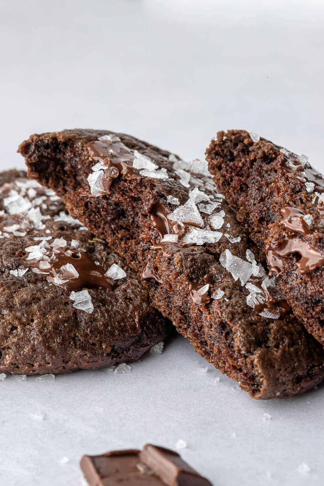 Closeup of a double chocolate vegan cookie cut in half.