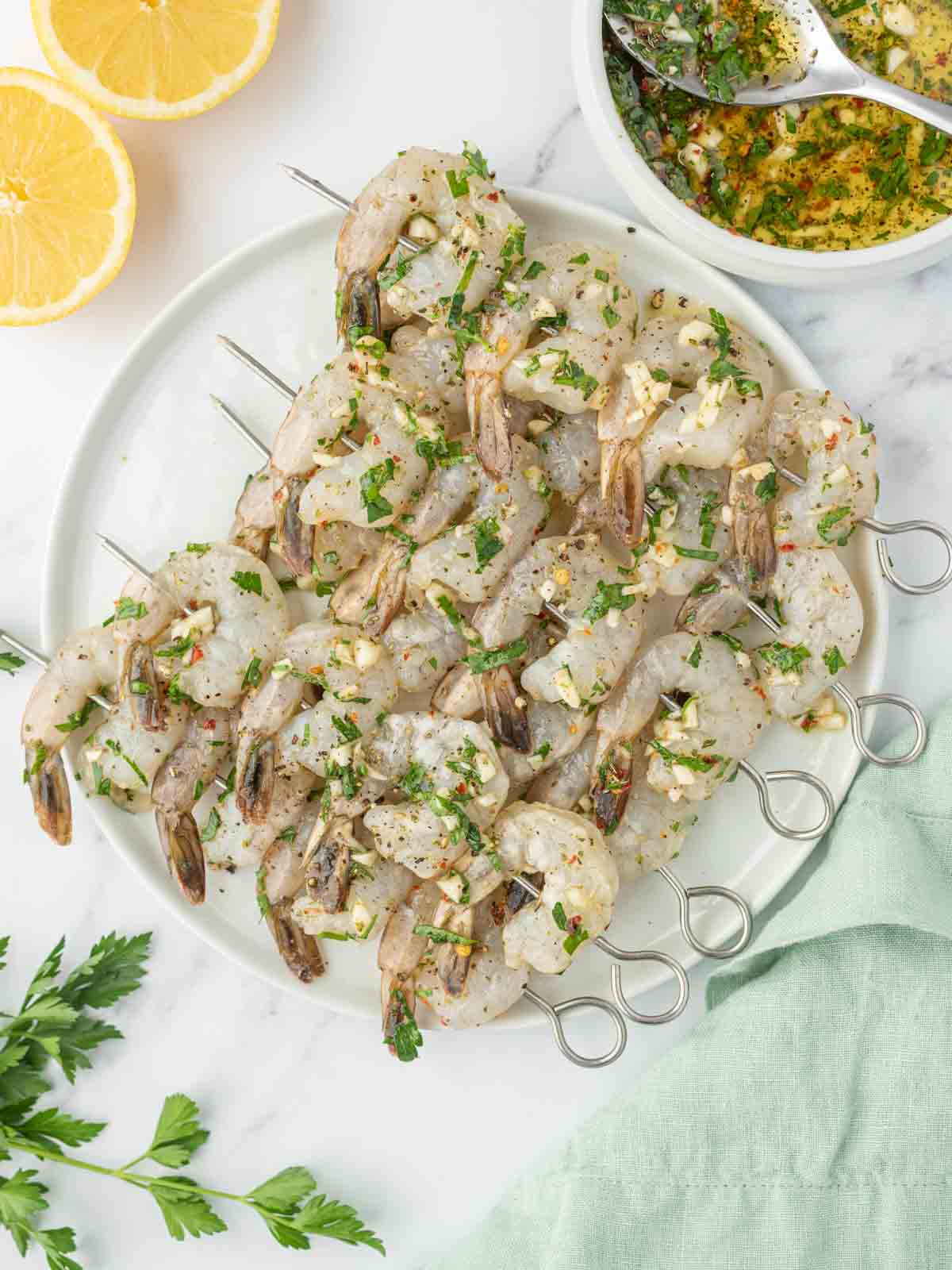 Shrimp skewers coated in a garlic citrus marinade.