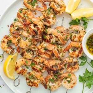 Garlicky Shrimp kabobs on a platter.