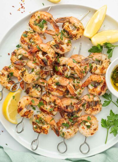 Garlicky Shrimp kabobs on a platter.