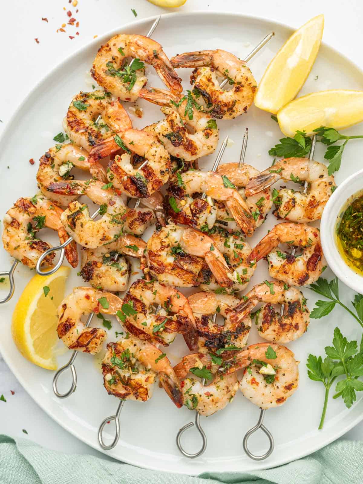 Garlicky Shrimp kabobs on a platter.