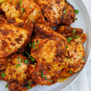 air fried boneless chicken thighs serves on a plate