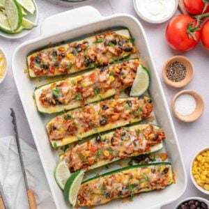 Southwest zucchini boats with ground turkey, black beans, corn, melted cheese, cilantro, and lime.