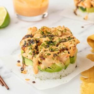 Spicy shrimp layered over avocado, cucumber, and seasoned sushi rice.