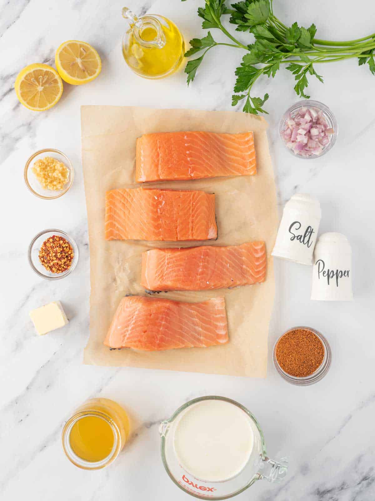 Ingredients needed for creamy cajun salmon recipe.