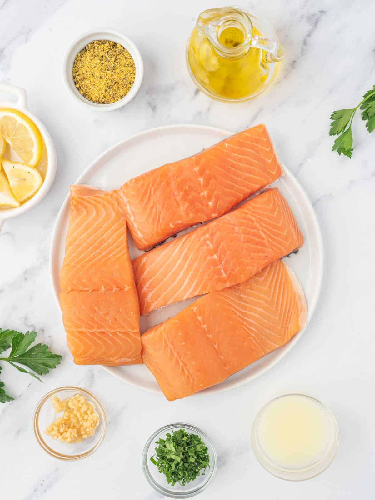 Ingredients needed for baked lemon pepper salmon.