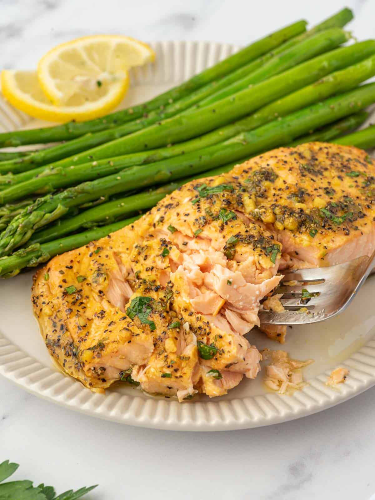 A plate of flakey lemon pepper salmon.