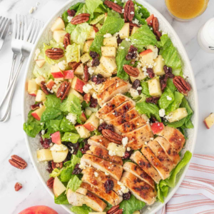 Sliced grilled chicken served over romaine with apples, cranberries, pecans, and feta.