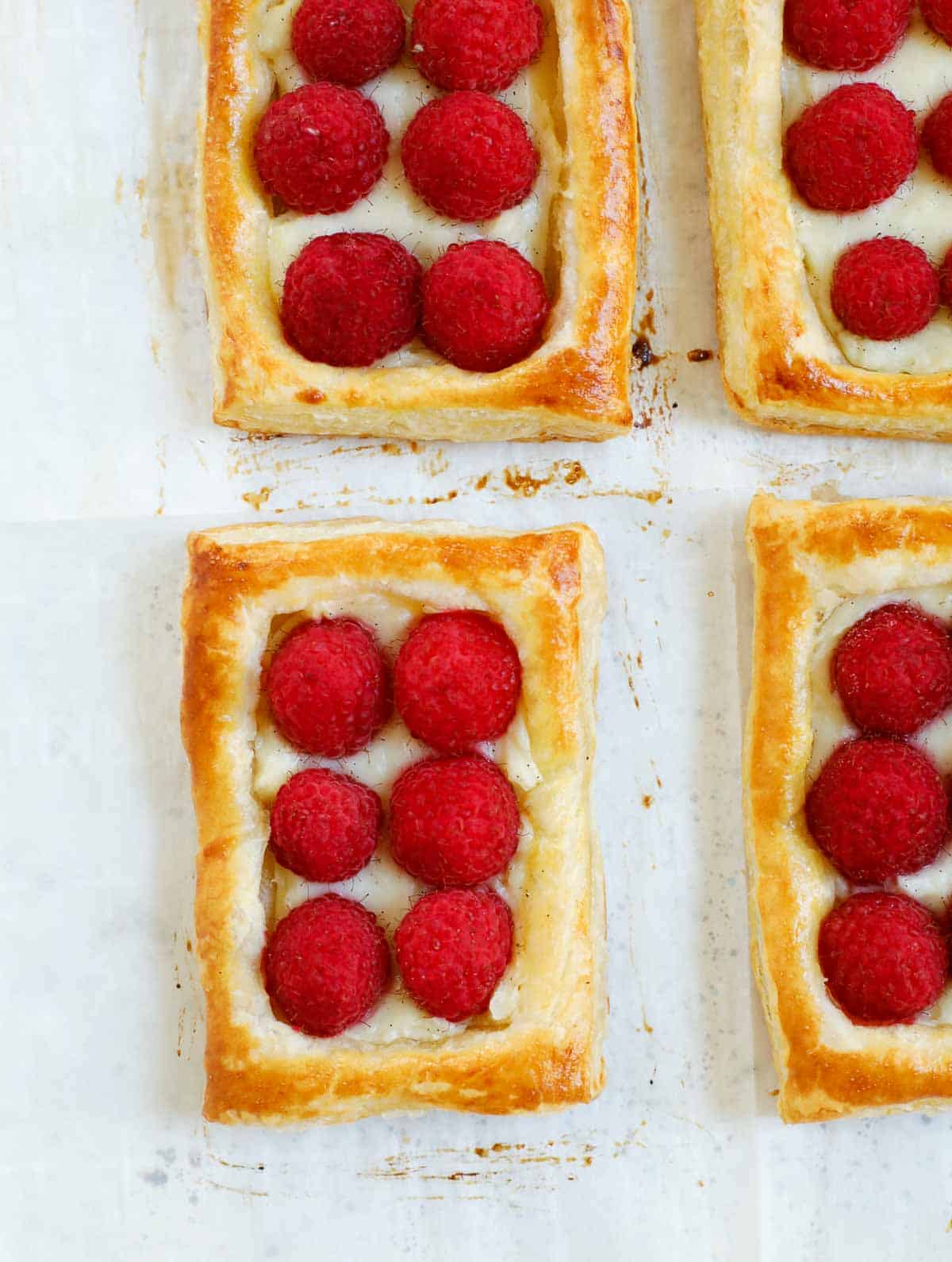 raspberry tart baked on a sheet pan