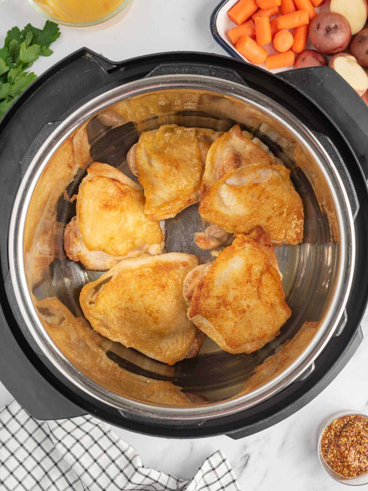 Sear chicken thighs in Instant Pot.