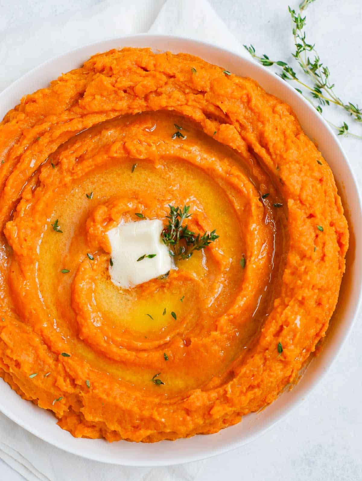 Easy Mashed Sweet Potatoes served on a white dish