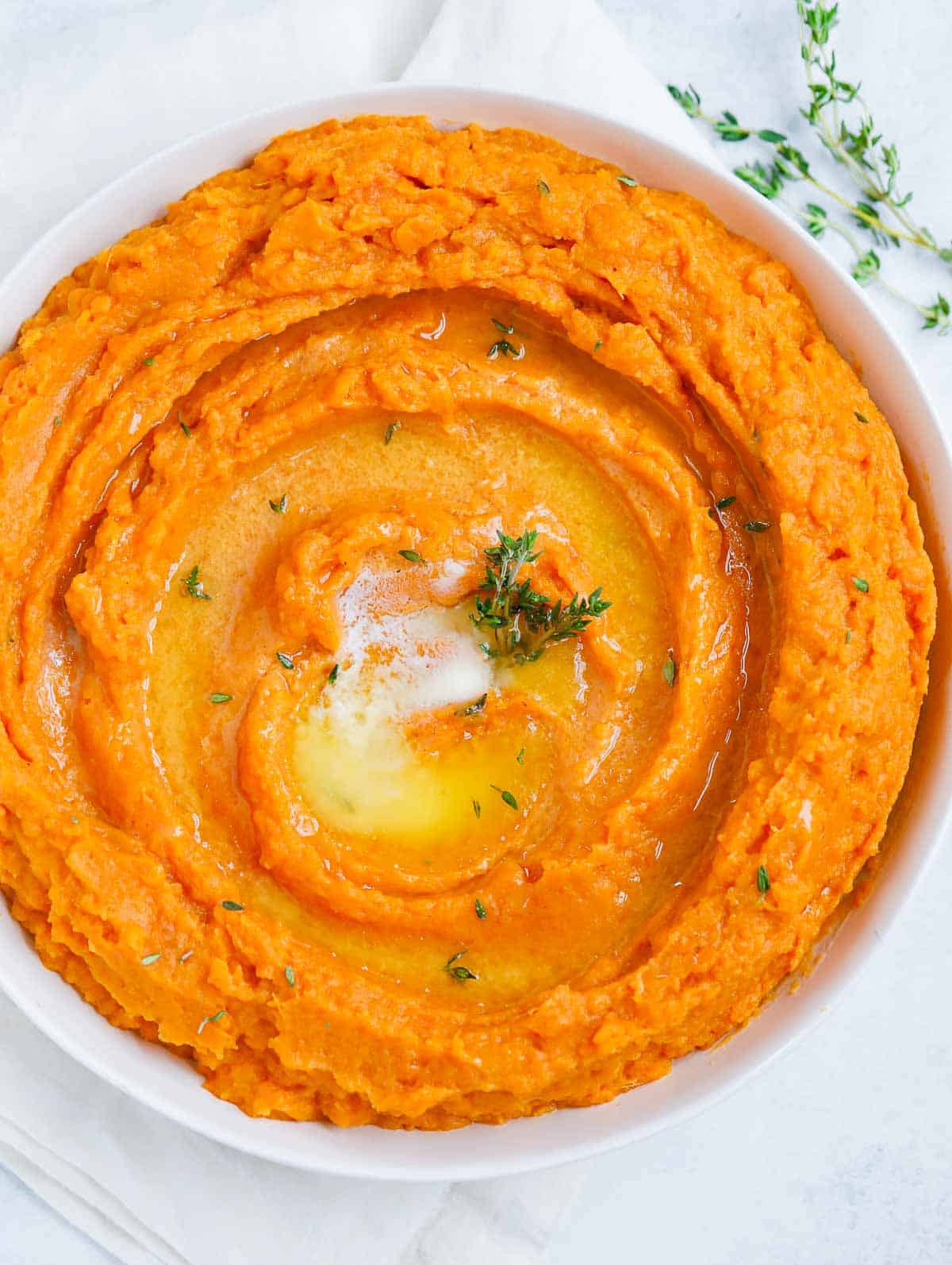 Mashed Sweet Potatoes served in a white dish