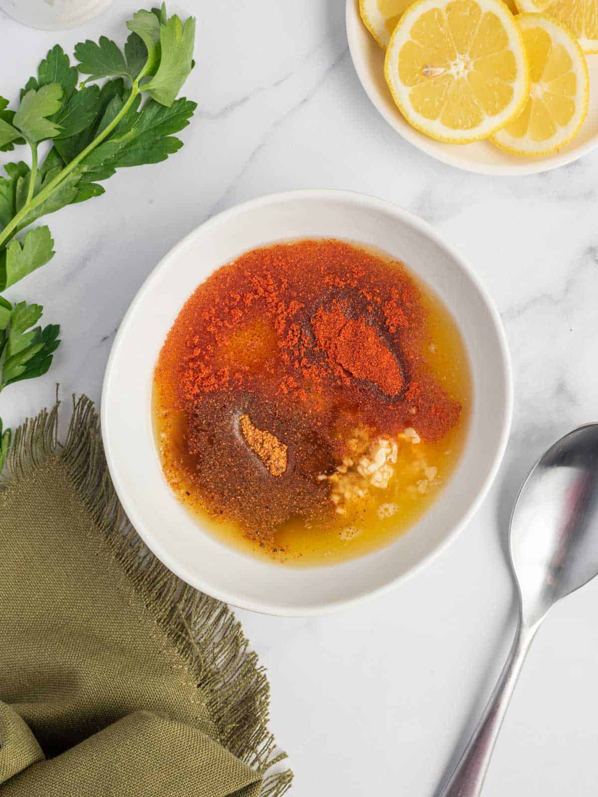 A bowl of cajun garlic butter sauce.