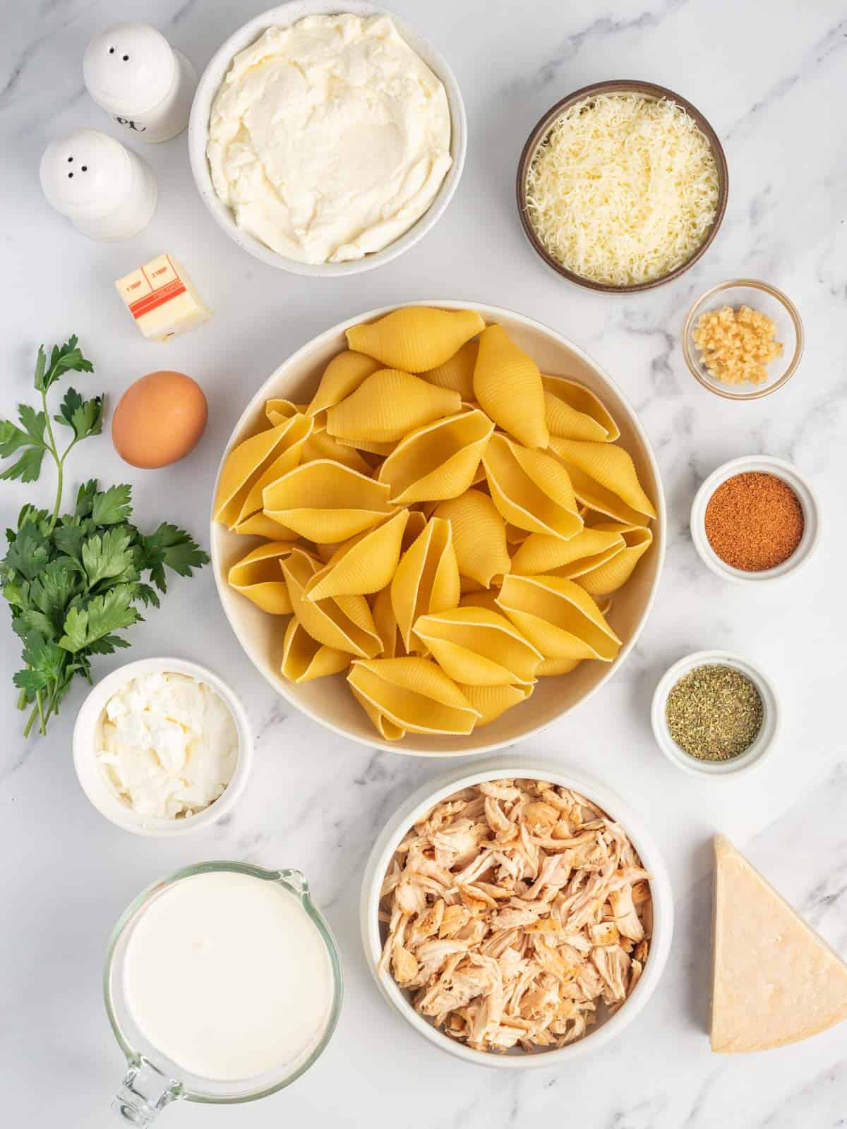 Ingredients needed for cajun chicken alfredo stuffed shells.