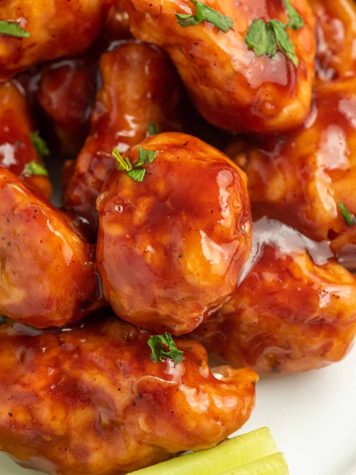 Closeup of bbq coated chicken.