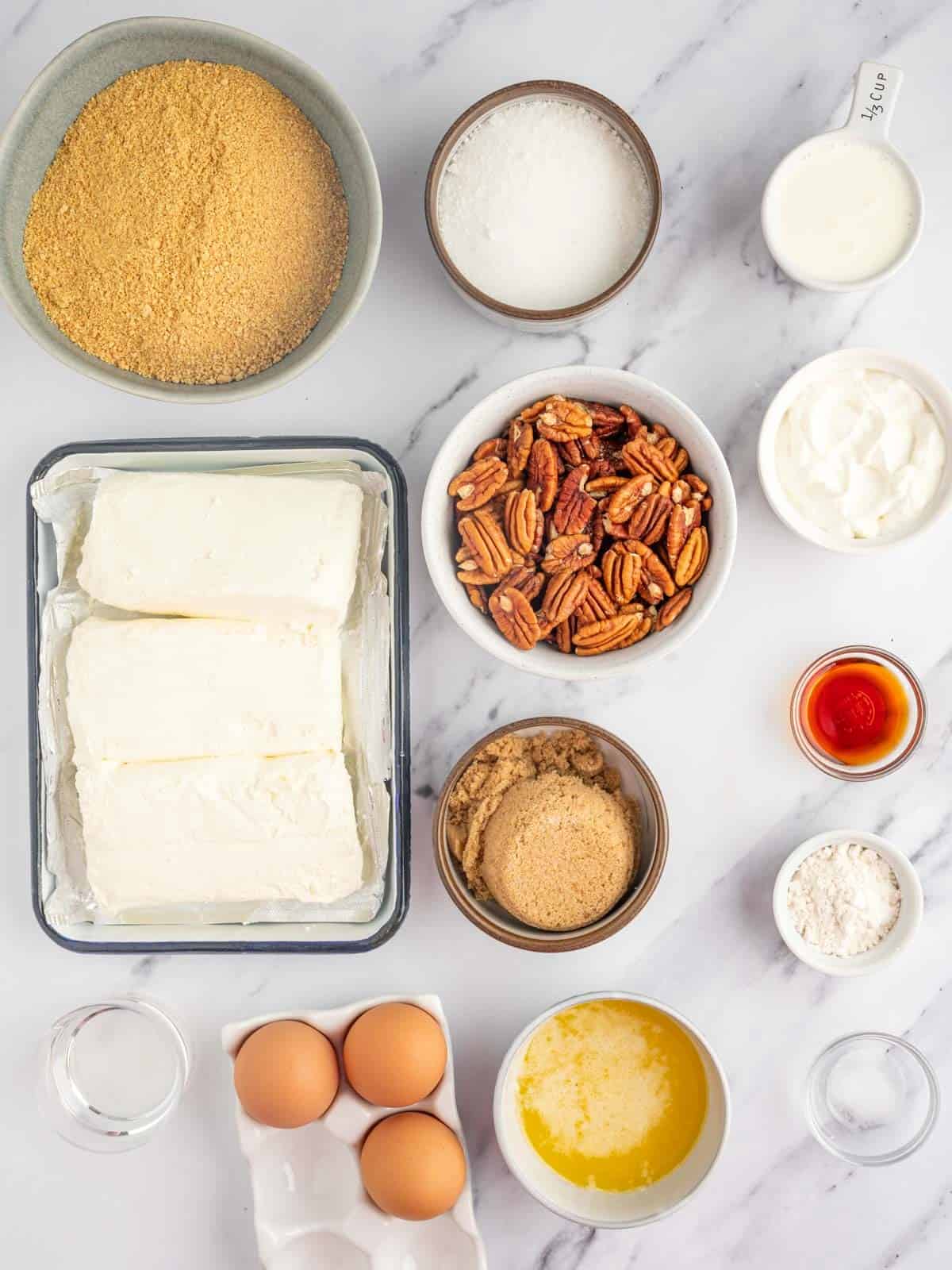 Ingredients needed for pecan pie cheesecake.