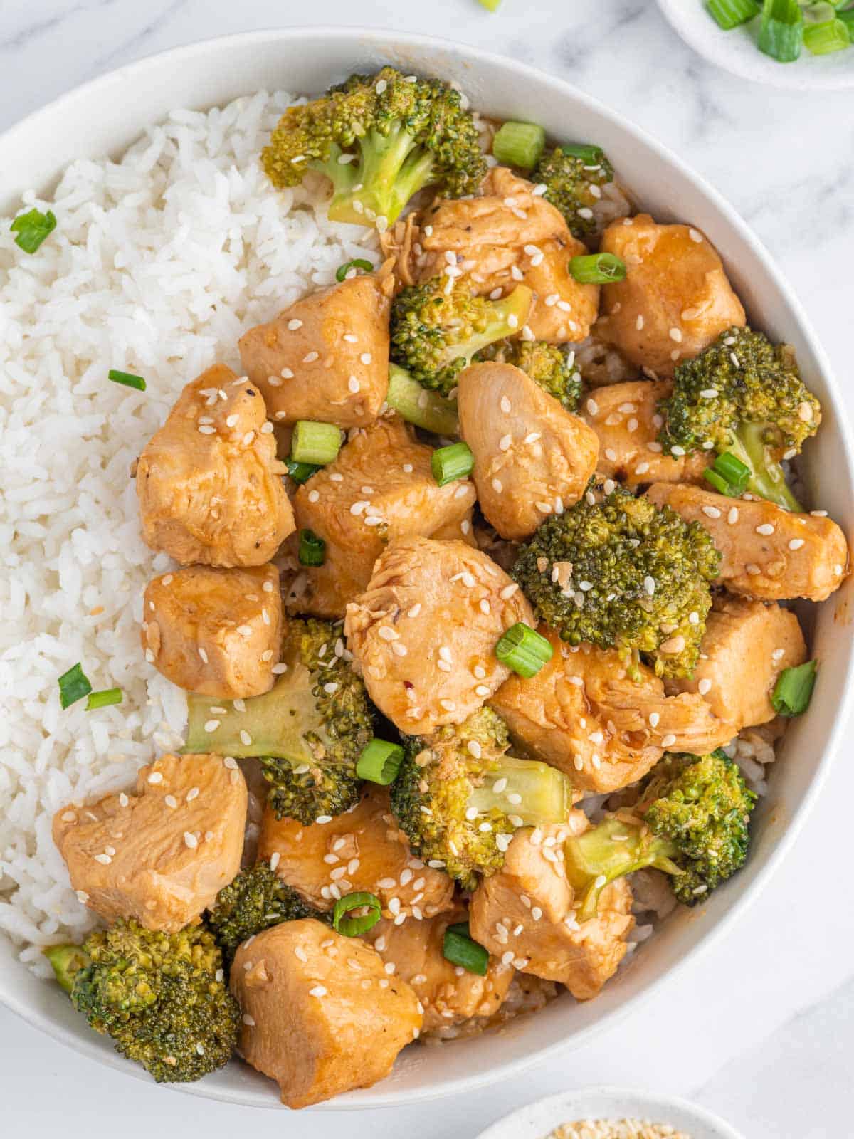 Chicken and broccoli instant pot stir fry on a plate with rice.