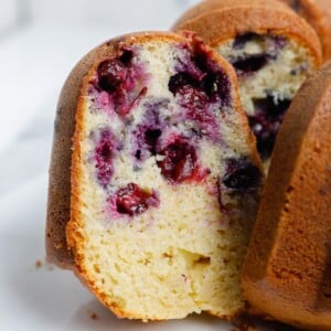 a slice of blueberry cake showing the inside.