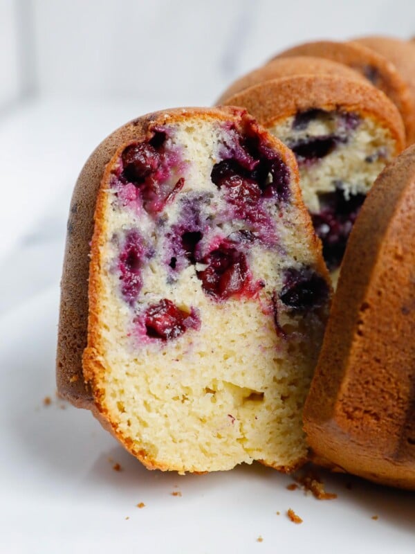 a slice of blueberry cake showing the inside.