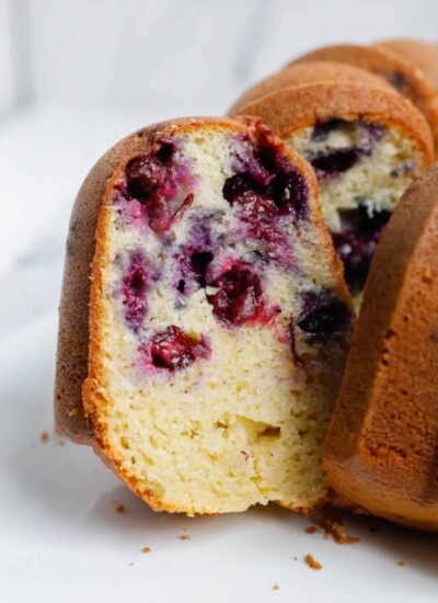 a slice of blueberry cake showing the inside.