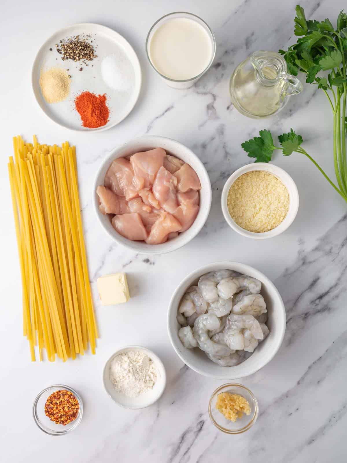 Ingredients needed for chicken and shrimp alfredo.